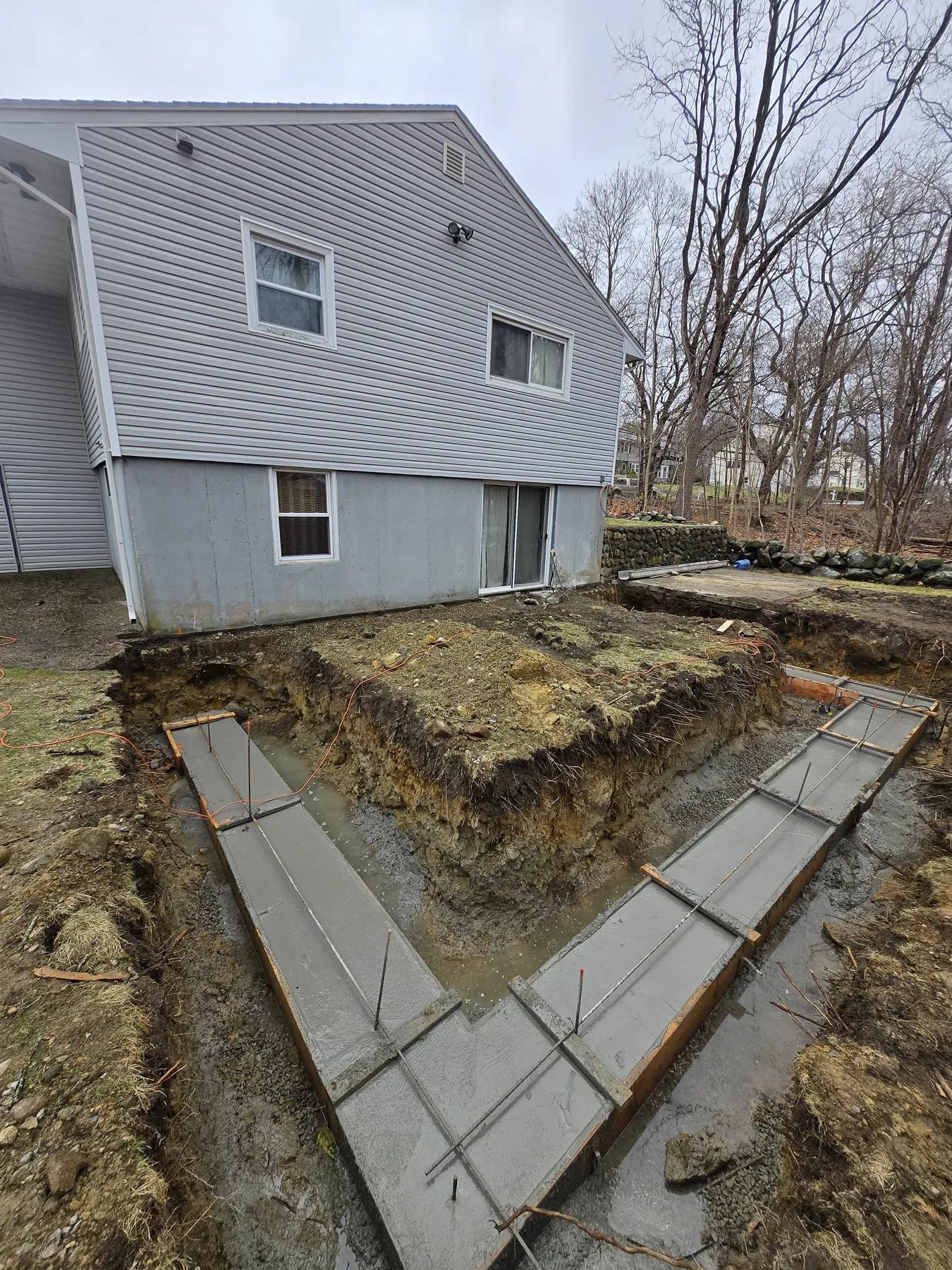 Home addition foundation and framing by Wolf Carpenters