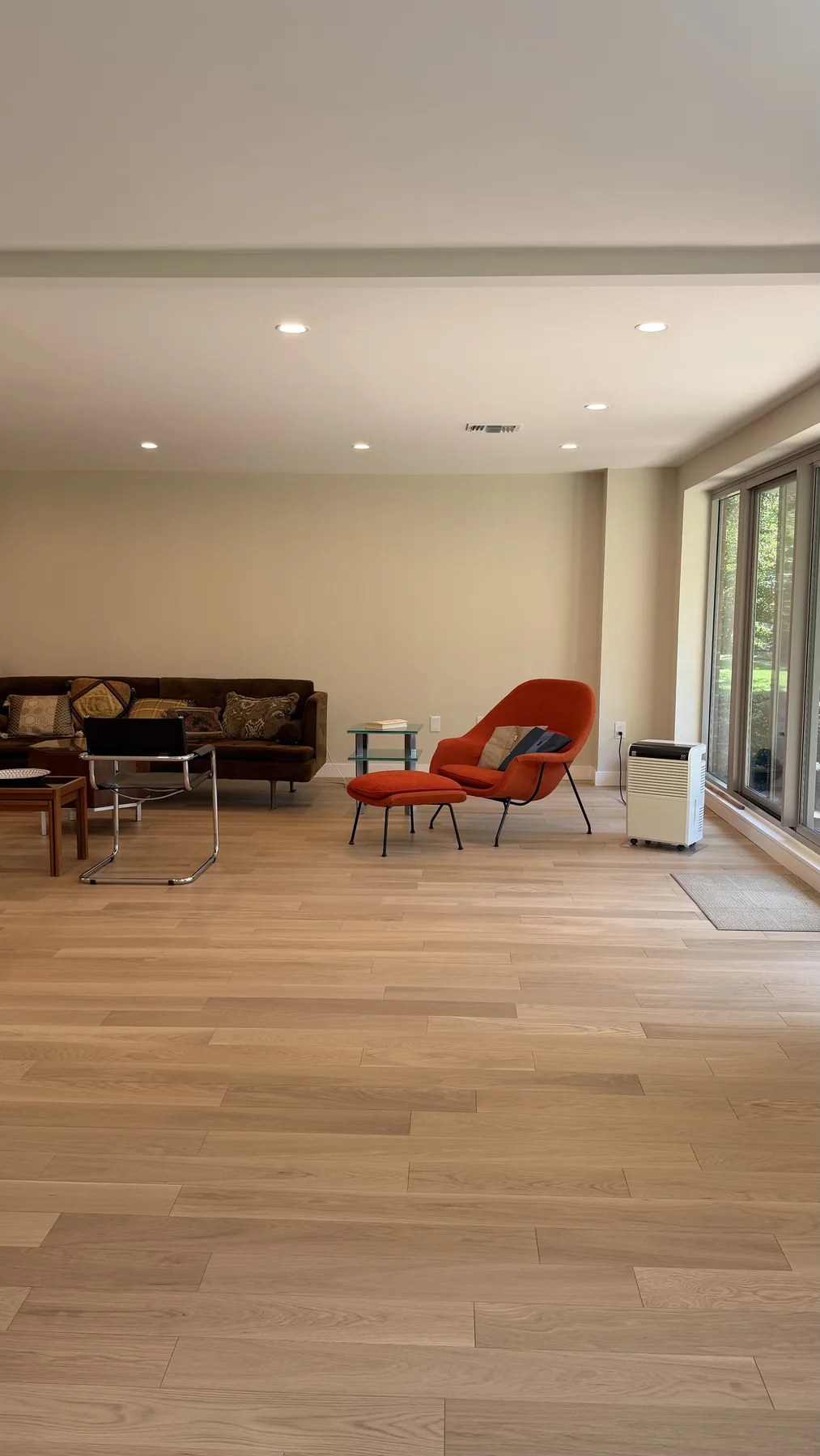 Renovated bedroom with hardwood floors and natural light by Wolf Carpenters