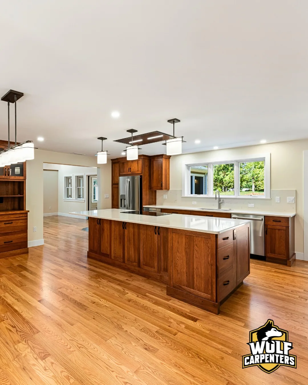 Full kitchen renovation with wood cabinetry and quartz counters in North Andover, MA
