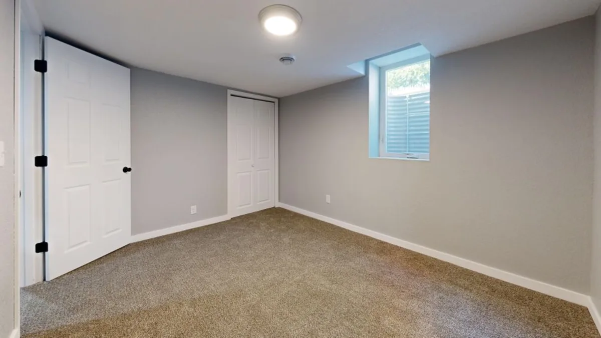 Finished basement living space in Swampscott, MA by Wolf Carpenters